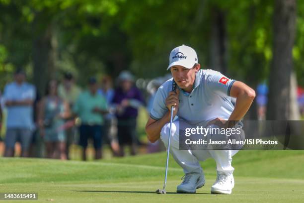 Matt Fitzpatrick of England checks his line before putting on the green of hole during Round One of the Zurich Classic of New Orleans at TPC...