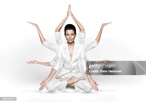 woman practicing yoga - schneidersitz stock-fotos und bilder