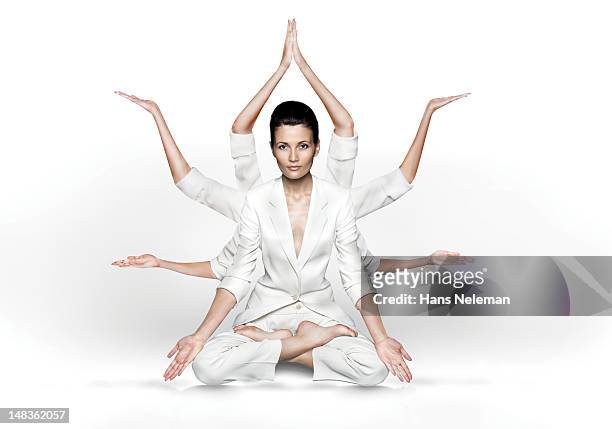 woman practicing yoga - lotuspositie stockfoto's en -beelden