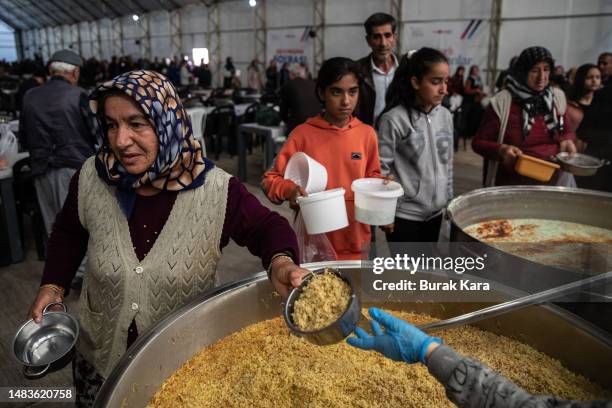 Earthquake survivors receive hot meal to break their fast in the last day of Ramadan in Felicity Party's field kitchen on April 20, 2023 in Adiyaman,...