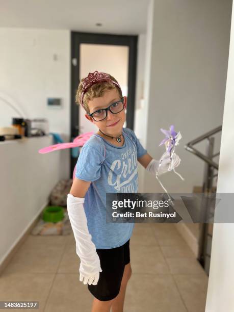 10-year-old boy dressed up as a fairy at home - fairy princess stock pictures, royalty-free photos & images