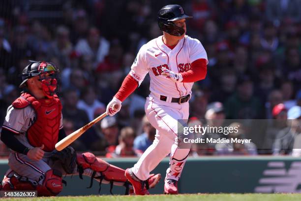 Masataka Yoshida of the Boston Red Sox hits a single during the third inning against the Minnesota Twins at Fenway Park on April 20, 2023 in Boston,...