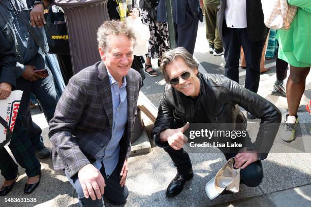 Michael Bacon and Kevin Bacon pose by their plaque at the 2023 Philadelphia Music Alliance Walk Of Fame Plaque Unveilings outside of University of...