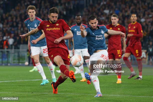 Bryan Cristante of AS Roma challenges David Hancko of Feyenoord as they clear the ball during the UEFA Europa League Quarterfinal Second Leg match...