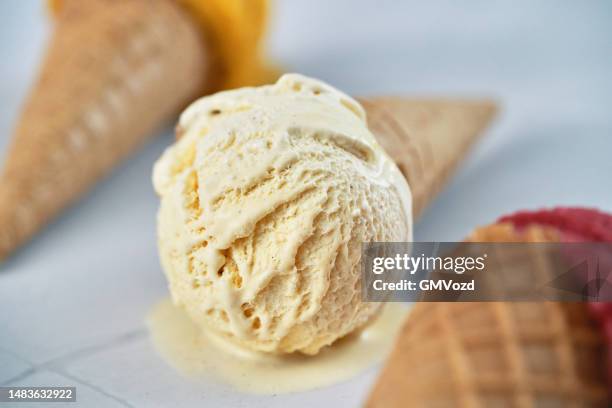 raspberry, vanilla, mango ice cream in a cone - vanilla stock pictures, royalty-free photos & images
