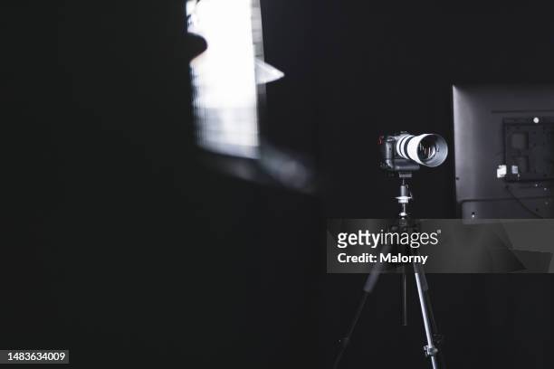 close-up of photo studio set-up. light system. black background. - tripod lamp stock pictures, royalty-free photos & images