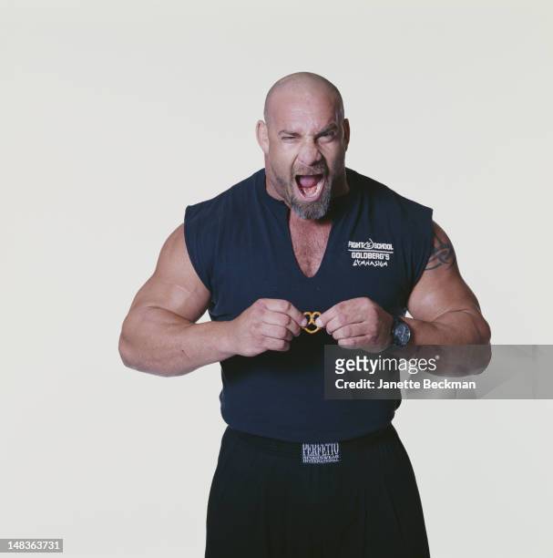 Former professional wrestler Bill Goldberg tries to rip apart a pretzel with his bare hands, New York City, 2005.