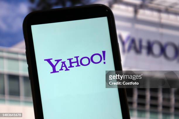 Yahoo page is displayed on a mobile phone in Yichang, Hubei province, China, July 4, 2003. At noon on July 4 Yahoo CEO Jim Lanzone reportedly said he...
