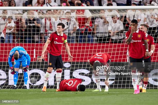 Players of Manchester United react after Loic Bade of Sevilla FC goal during the UEFA Europa League quarterfinal second leg match between Sevilla FC...