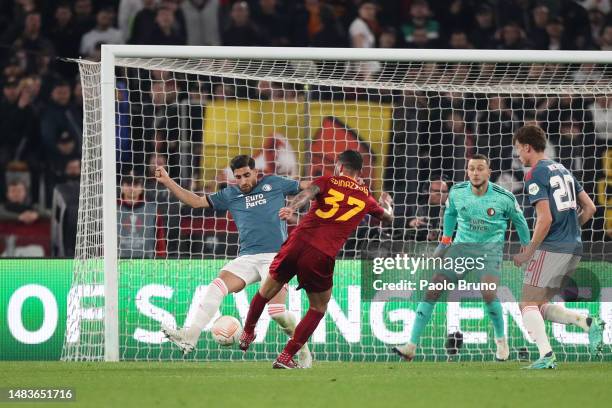 Leonardo Spinazzola of AS Roma scores the team's first goal whilst under pressure during the UEFA Europa League Quarterfinal Second Leg match between...