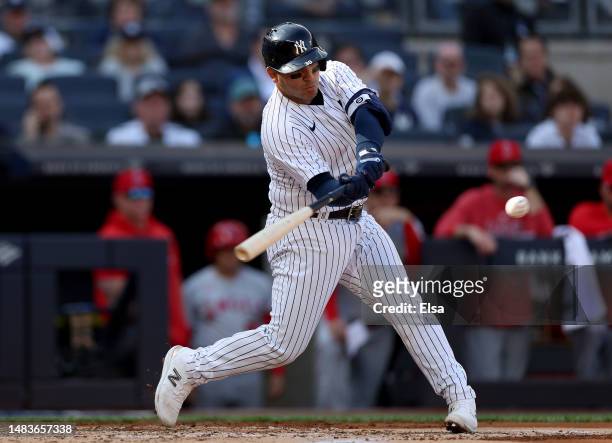 Jose Trevino of the New York Yankees hits a 3RBI double in the first inning against the Los Angeles Angels at Yankee Stadium on April 20, 2023 in the...