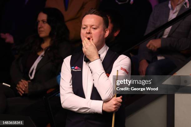 Shaun Murphy of England reacts during their round one match against Si Jiahui of China on Day Six of the Cazoo World Snooker Championship 2023 at...