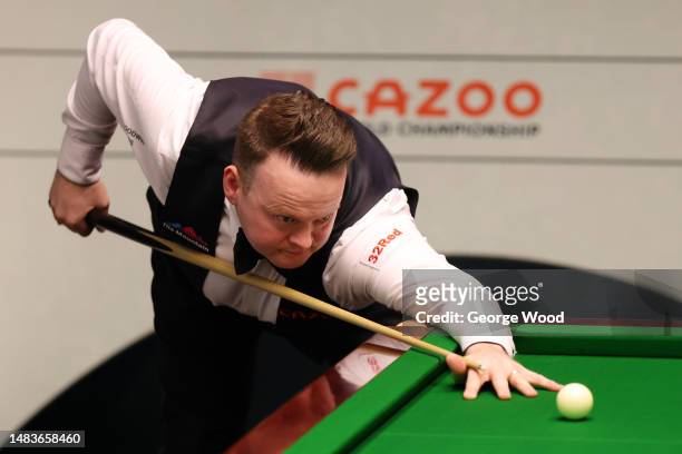 Shaun Murphy of England plays a shot during their round one match against Si Jiahui of China on Day Six of the Cazoo World Snooker Championship 2023...