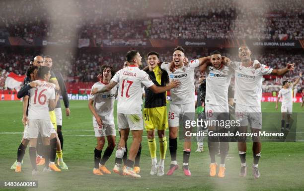 Players of Sevilla FC celebrate victory in front of their fans after defeating Manchester United during the UEFA Europa League Quarterfinal Second...