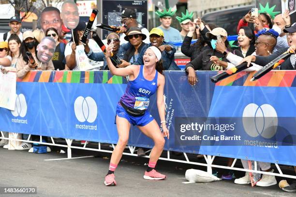 Runner Sofia Maria Jimenez stop and take a picture with fans during the 2022 TCS New York City Marathon is held on November 6, 2022 in New York, NY....