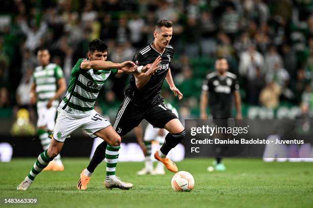 Arkadiusz Krystian Milik of Juventus battles for the ball with Ricardo Esgaio of Sporting CP during the UEFA Europa League quarterfinal second leg...