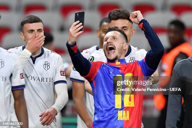 Taulant Xhaka of FC Basel celebrates victory with teammates as they film with a Selfie with a mobile phone after the UEFA Europa Conference League...