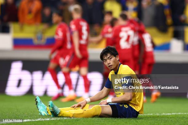 Koki Machida of Royale Union Saint-Gilloise reacts after Bayer 04 Leverkusen's fourth goal during the UEFA Europa League quarterfinal second leg...