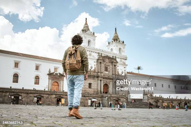 man looking at plaza de san francisco - ecuador people stock pictures, royalty-free photos & images