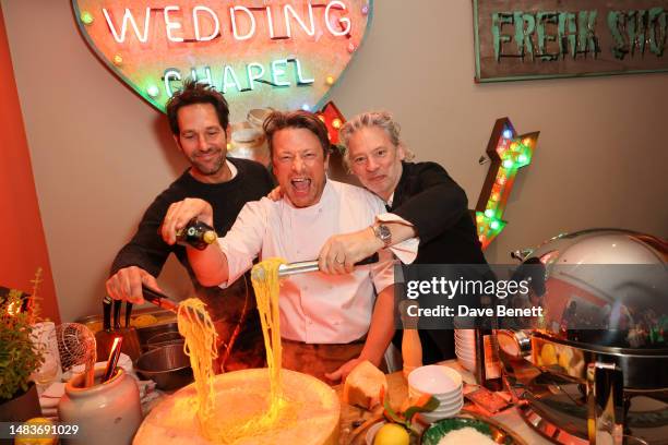 Paul Rudd, Jamie Oliver and Dexter Fletcher celebrate at the Apple Original Films tastemaker screening afterparty for "Ghosted" at The Ham Yard Hotel...