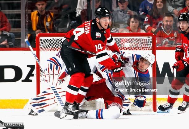Nathan Bastian of the New Jersey Devils checks Filip Chytil of the New York Rangers during the first period in Game Two in the First Round of the...