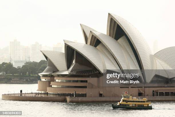 Sydney Ferry, the Golden Grove, moves past the Sydney Opera House on March 3, 2023 in Sydney, Australia.