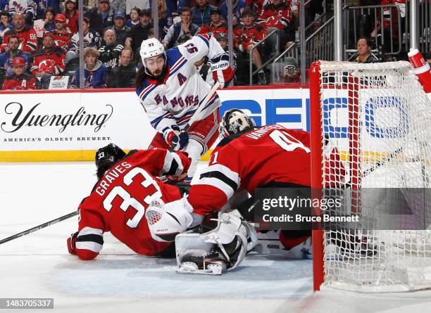 Mika Zibanejad of the New York Rangers is stopped by Vitek Vanecek of the New Jersey Devils during the first period during Game Two in the First...