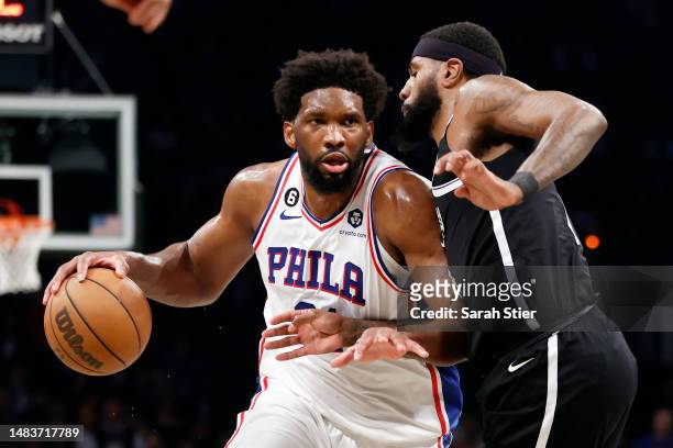 Joel Embiid of the Philadelphia 76ers dribbles against Royce O'Neale of the Brooklyn Nets during the second half of Game Three of the Eastern...