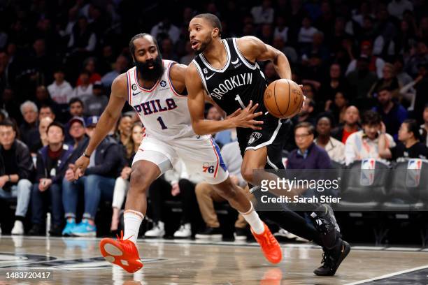 Mikal Bridges of the Brooklyn Nets dribbles against James Harden of the Philadelphia 76ers during the first half of Game Three of the Eastern...