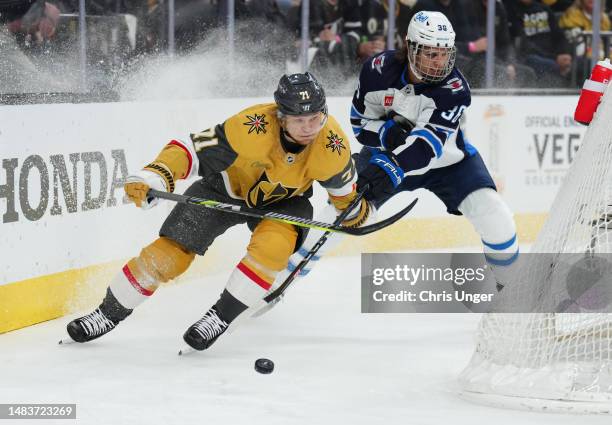 William Karlsson of the Vegas Golden Knights battles Morgan Barron of the Winnipeg Jets during the first period in Game Two of the First Round of the...