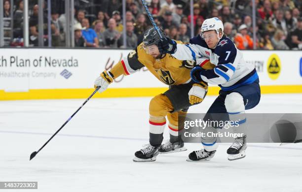 Vladislav Namestnikov of the Winnipeg Jets battles Nicolas Hague of the Vegas Golden Knights during the first period in Game Two of the First Round...