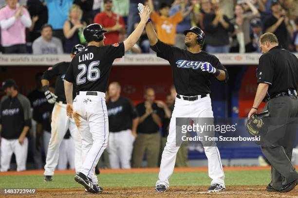 Vernon Wells of the Toronto Blue Jays is congratulated by Adam Lind after hitting a two-run home run in the sixth inning during MLB game action...