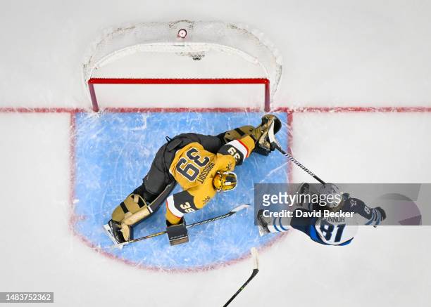 April 20: Laurent Brossoit of the Vegas Golden Knights makes a save against Kyle Connor of the Winnipeg Jets during the first period in Game Two of...