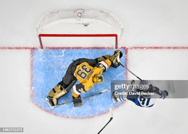 April 20: Laurent Brossoit of the Vegas Golden Knights makes a save against Kyle Connor of the Winnipeg Jets during the first period in Game Two of...