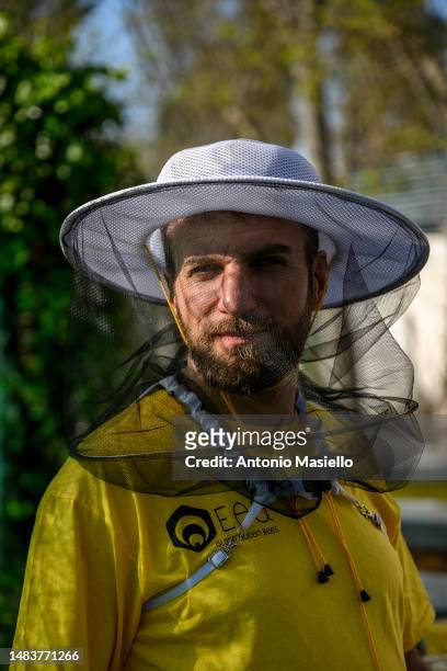 Lorenzo Buratti, beekeeper - breeder, poses while inspecting the beehives, on April 20, 2023 in Terracina, Italy. The effects of climate change...