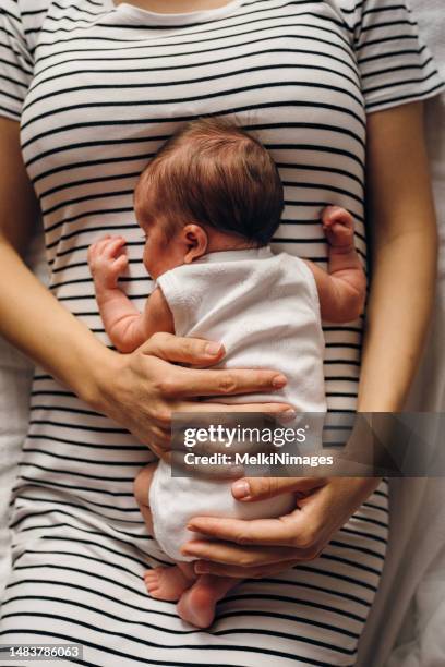 new born baby bonding with his mother - baby girl laying on tummy stock pictures, royalty-free photos & images