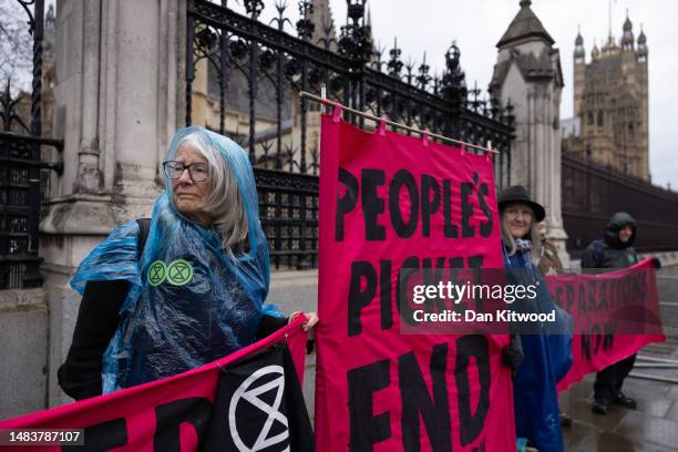 Extinction Rebellion protesters outside the Houses of Parliament on April 21, 2023 in London, England.