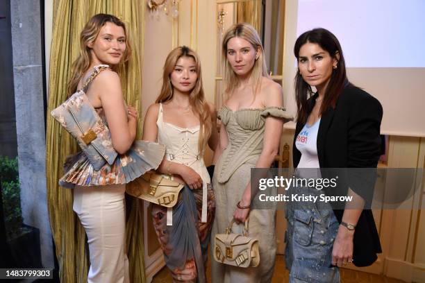 Chloe Lecareux, Caroline Hu, Natalia Verza and Deborah Reyner Sebag attending the Balmain x evian collection first look at the Plaza Athénée Hotel on...