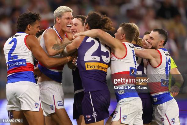 Alex Pearce of the Dockers and Rory Lobb of the Bulldogs wrestle before the first bounce during the round six AFL match between Fremantle Dockers and...