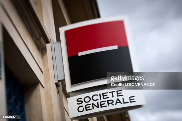 Picture taken with a tilt and shift lens on April 29, 2012 in Paris shows the logo of the Societe Generale bank at the entrance of an agency. AFP...