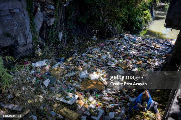 Creek clogged in plastic waste is seen on April 19, 2023 in Las Pinas, Metro Manila, Philippines. The Philippines is the largest ocean polluter in...