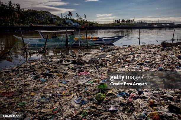 Boat docks at a beach filled with plastic waste at Freedom Island on April 19, 2023 in Paranaque, Metro Manila, Philippines. The Philippines is the...