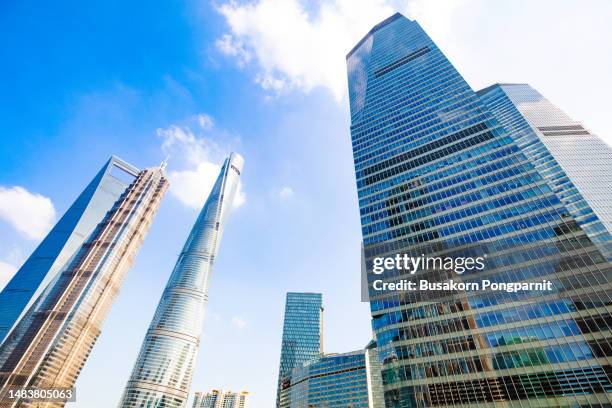 low angle view of the skyscrapers financial districtin in shanghaicity - city buildings stock pictures, royalty-free photos & images