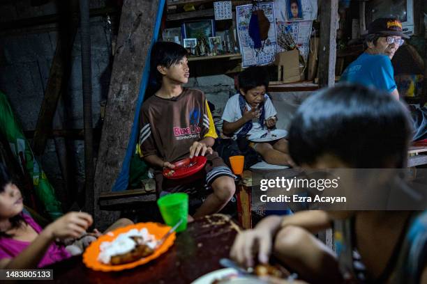 Lionilo Losanga sits at home with his grandchildren on April 11, 2023 in Quezon city, Metro Manila, Philippines. According to his wife Virgie...