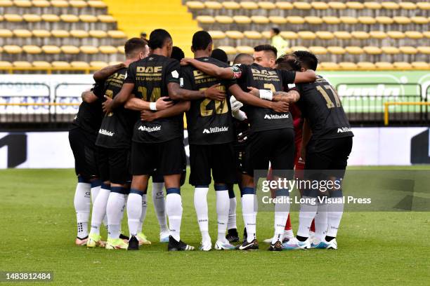 Once Caldas team members gather during the BetPlay Dimayor League match between Once Caldas and Equidad in Bogota, Colombia on April 11, 2023.