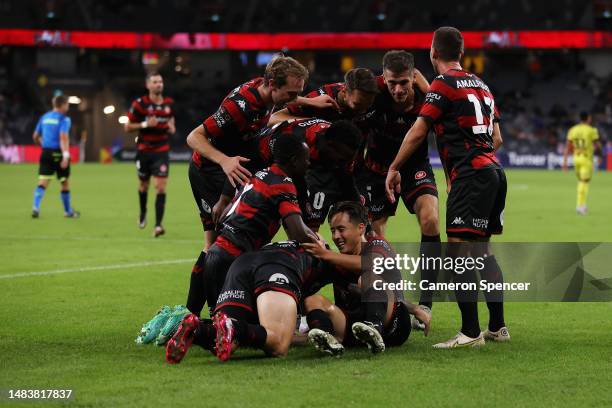 Aidan Simmons of the Wanderers celebrates kicking a goal with Brandon Borrello of the Wanderers and team mates during the round 25 A-League Men's...