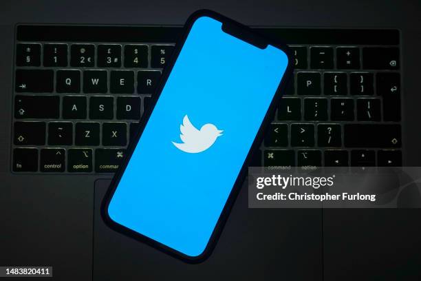 In this photo illustration the Twitter logo is seen on a mobile cellphone on April 21, 2023 in Knutsford, United Kingdom. The social media company...