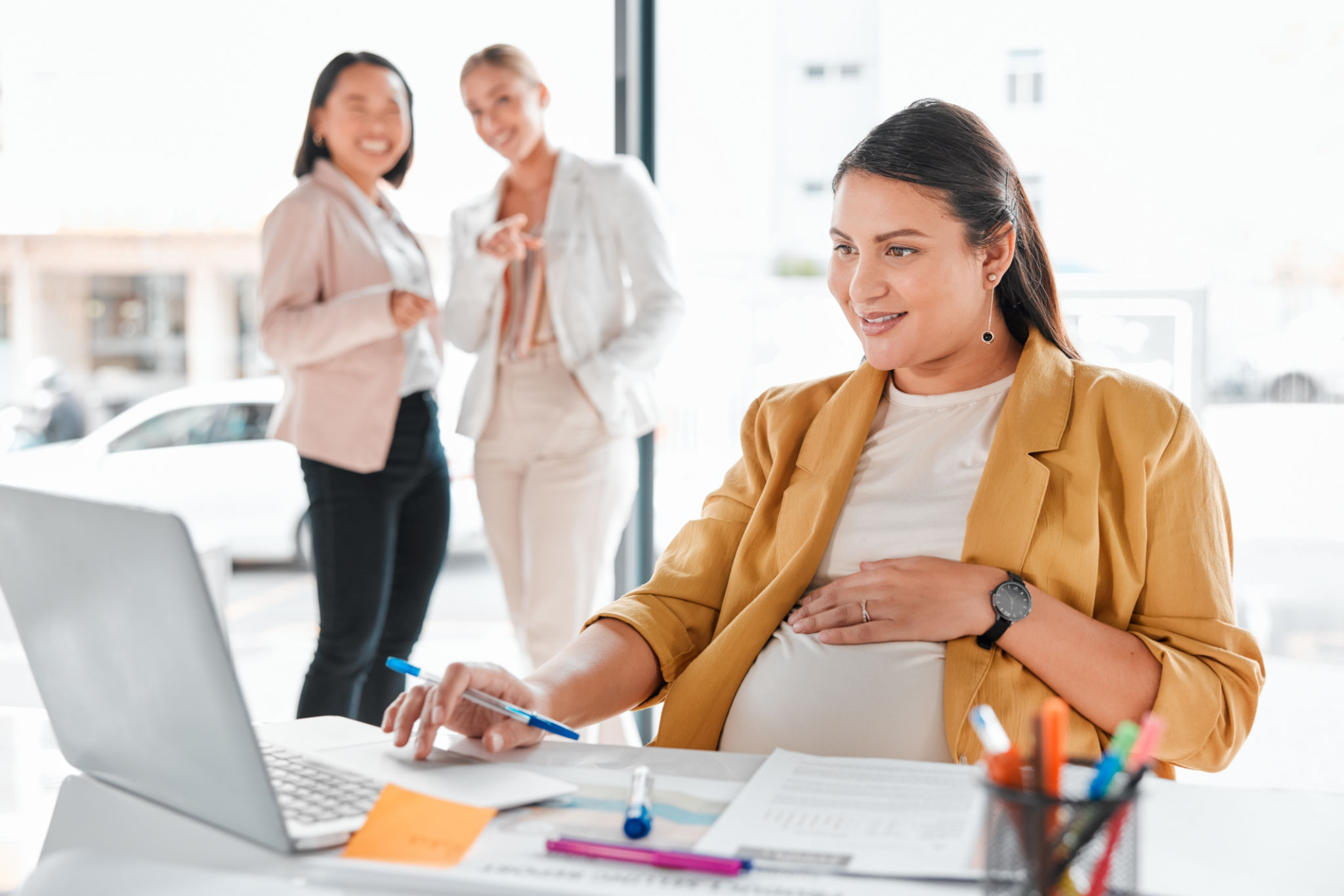 Gossip, pregnancy shame or business people pointing at pregnant woman in office working on laptop. Colleagues in workplace bullying, employee victim exclusion or worker harassment and discrimination Gossip, pregnancy shame or business people pointing at pregnant woman in office working on laptop. Colleagues in workplace bullying, employee victim exclusion or worker harassment and discrimination