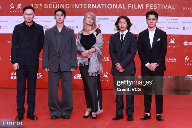 Director Lu Chuan , short track speed skater Wu Dajing , Chinese snowboarder Su Yiming and short track speed-skater Ren Ziwei arrive at opening...