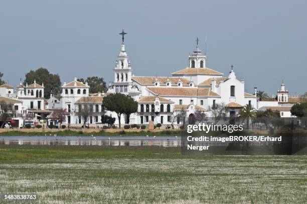 sanctuary ermita de el rocio with lagoon, el rocio, andalusia, spain - provincia de huelva stock pictures, royalty-free photos & images